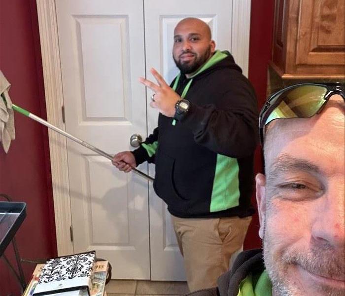 SERVPRO crew members working on a some seasonal cleaning work in a home