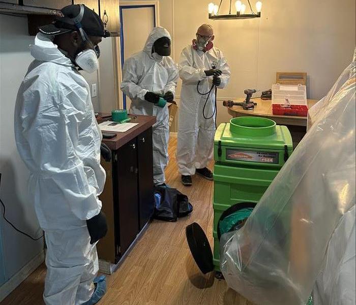 SERVPRO team in PPE dealing with a biohazard
